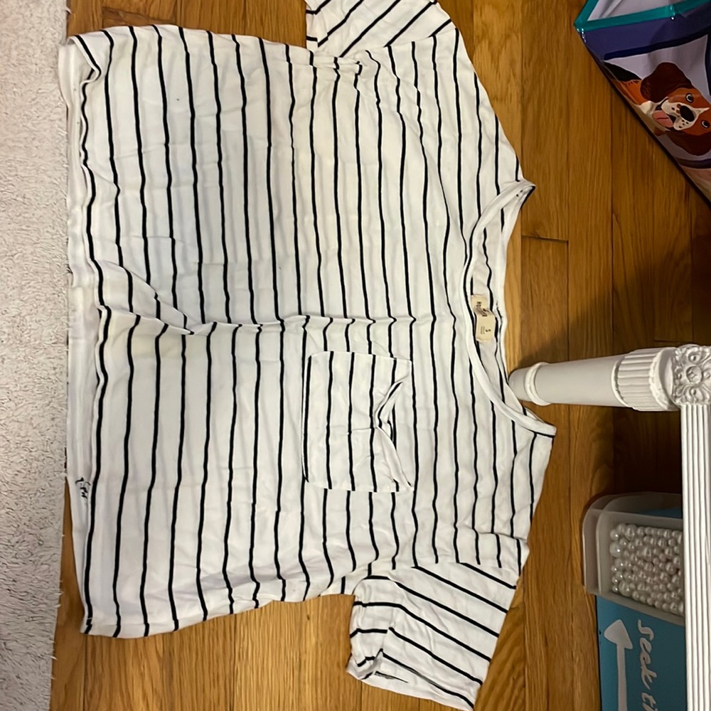 White cropped tee with thin black stripes and front pocket. Size S, Hollister.